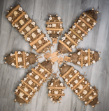 An array of sola cabin parrot toys, in sizes medium and large, arranged in a flower pattern.