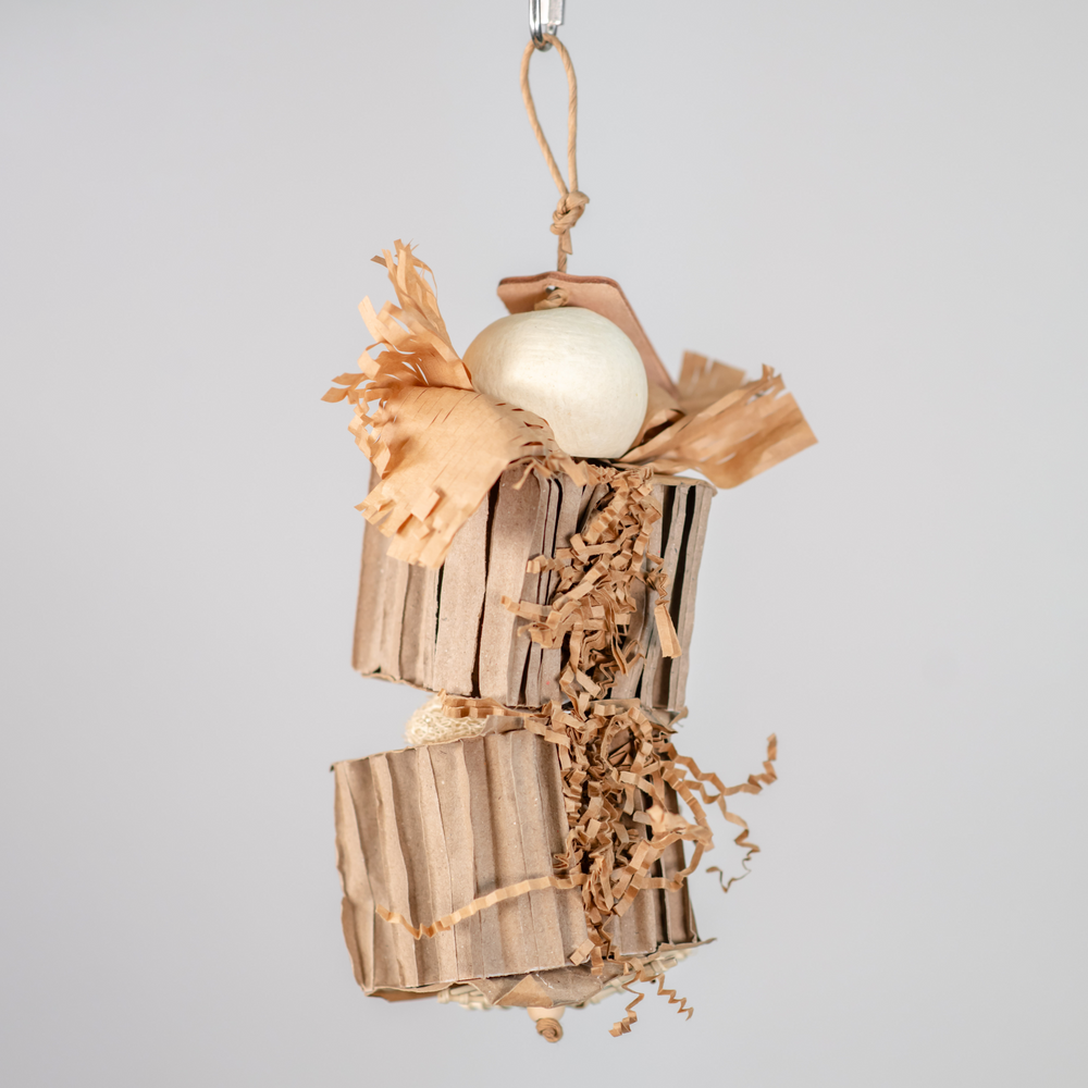 Cardboard Cruncher medium foraging bird toy with layers of cardboard and natural loofah for shredding and mental engagement