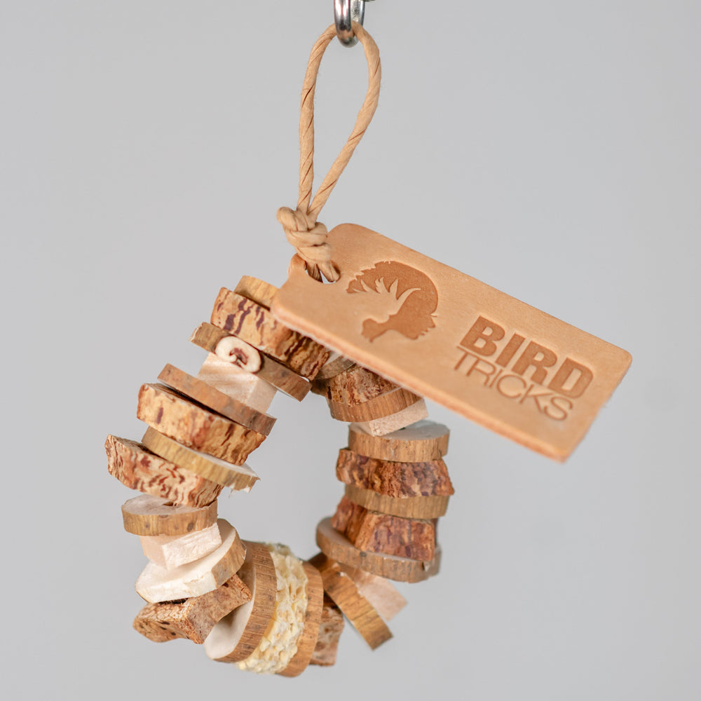 Enrichment Ring bird toy – tiny chunky toy with mahogany, balsa, sola slices, and dried corn cob for destructive fun