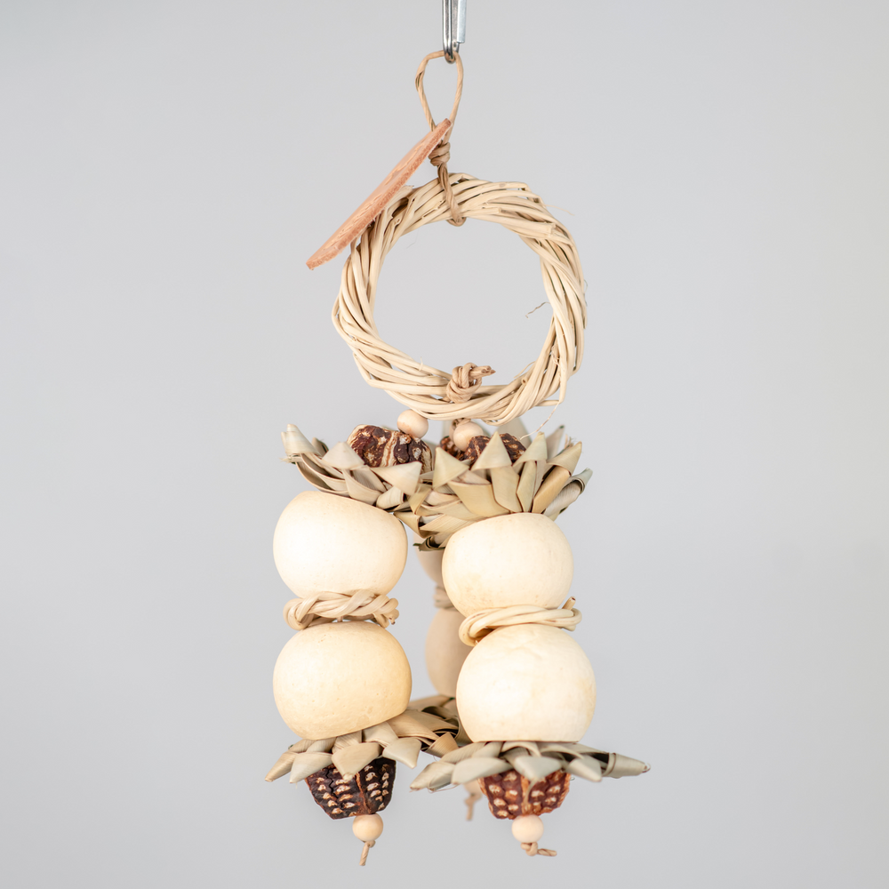 Natural Pod Blossom medium foraging bird toy with multiple bael pods, palm flowers, and a vine wreath for shredding and foraging