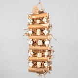 Sola Cabin large bird toy with sola logs, coconut shell, corn cob, and crinkle paper for interactive foraging and shredding